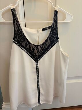 White Sleeveless Top with Black Lace Trim